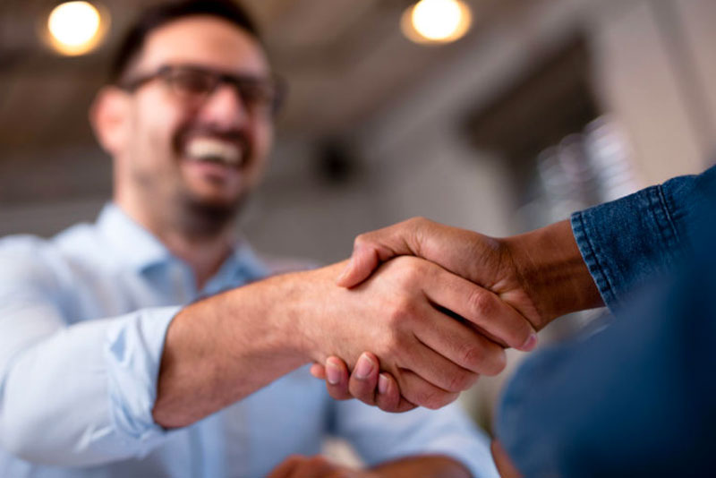 man shaking hands with doctor