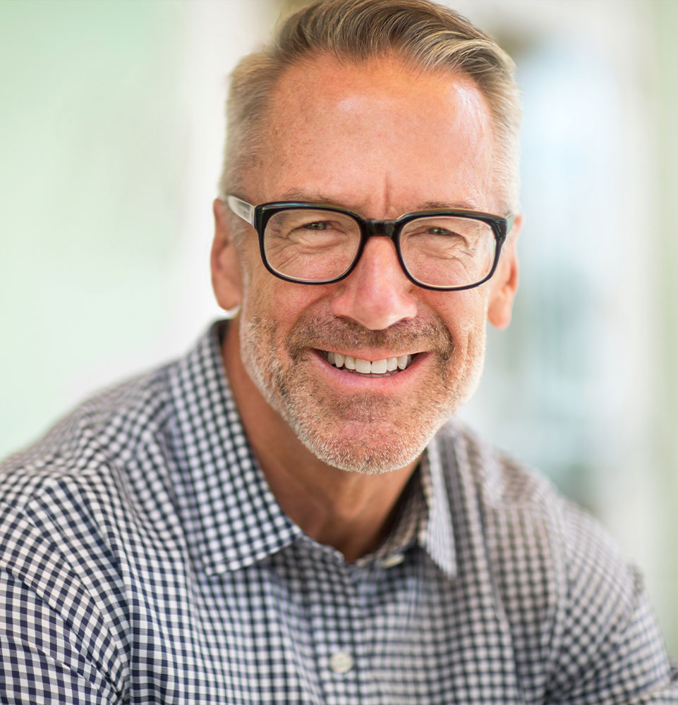 fixed dental implant patient smiling
