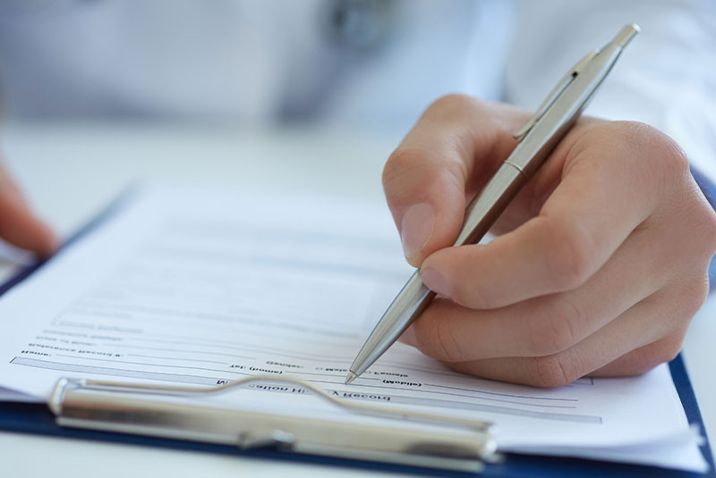 dental patient filling out intake forms