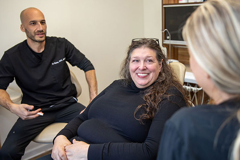 patient and doctor going over dental procedure information