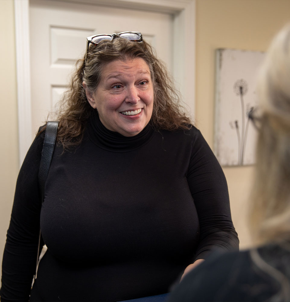 patient being helped at the front desk at the dental practice