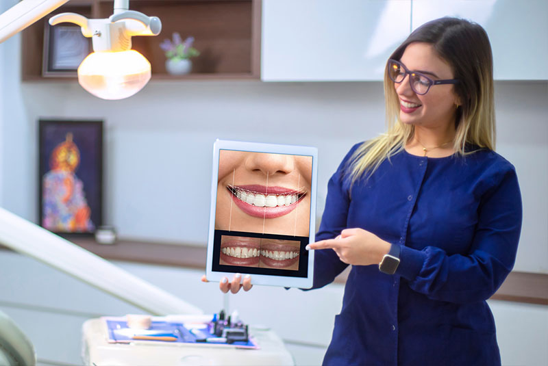 staff member showing example of smile design preview