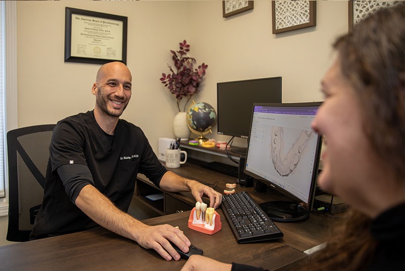 doctor going over dental procedure information with patient within the dental practice