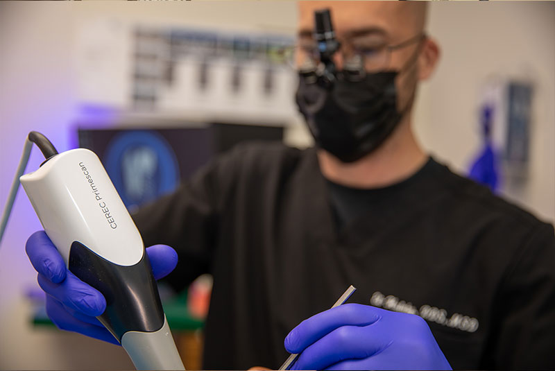 doctor performing dental scanning for procedure