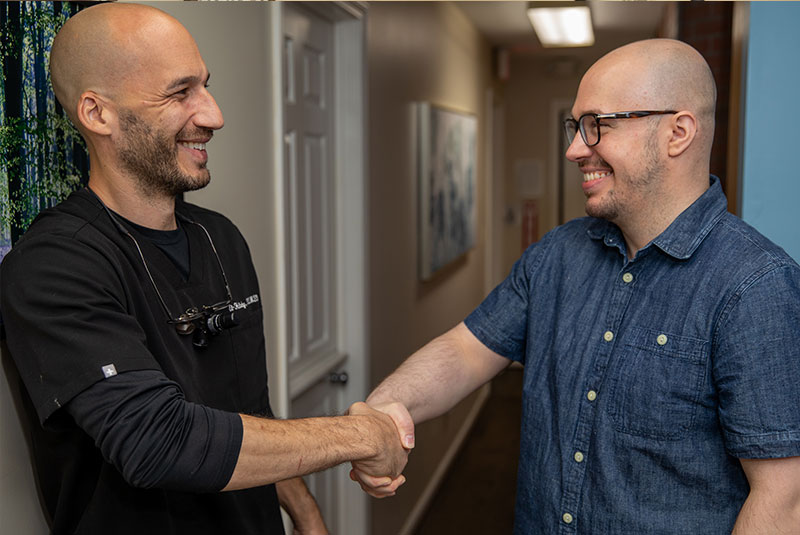 patient and doctor shaking hands after patient's procedure