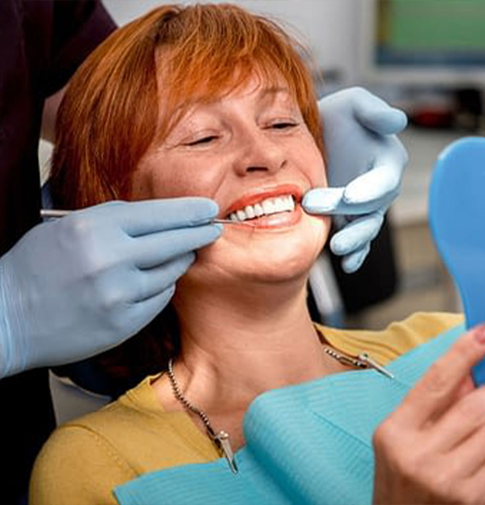 patient smiling after their dental procedure within the dental practice