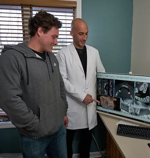 Dr. Halaby Showing Patient X-Ray Technology