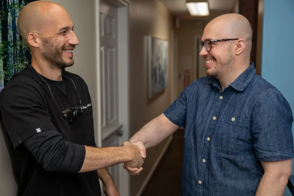 Dr. Halaby Shaking Hands With Patient