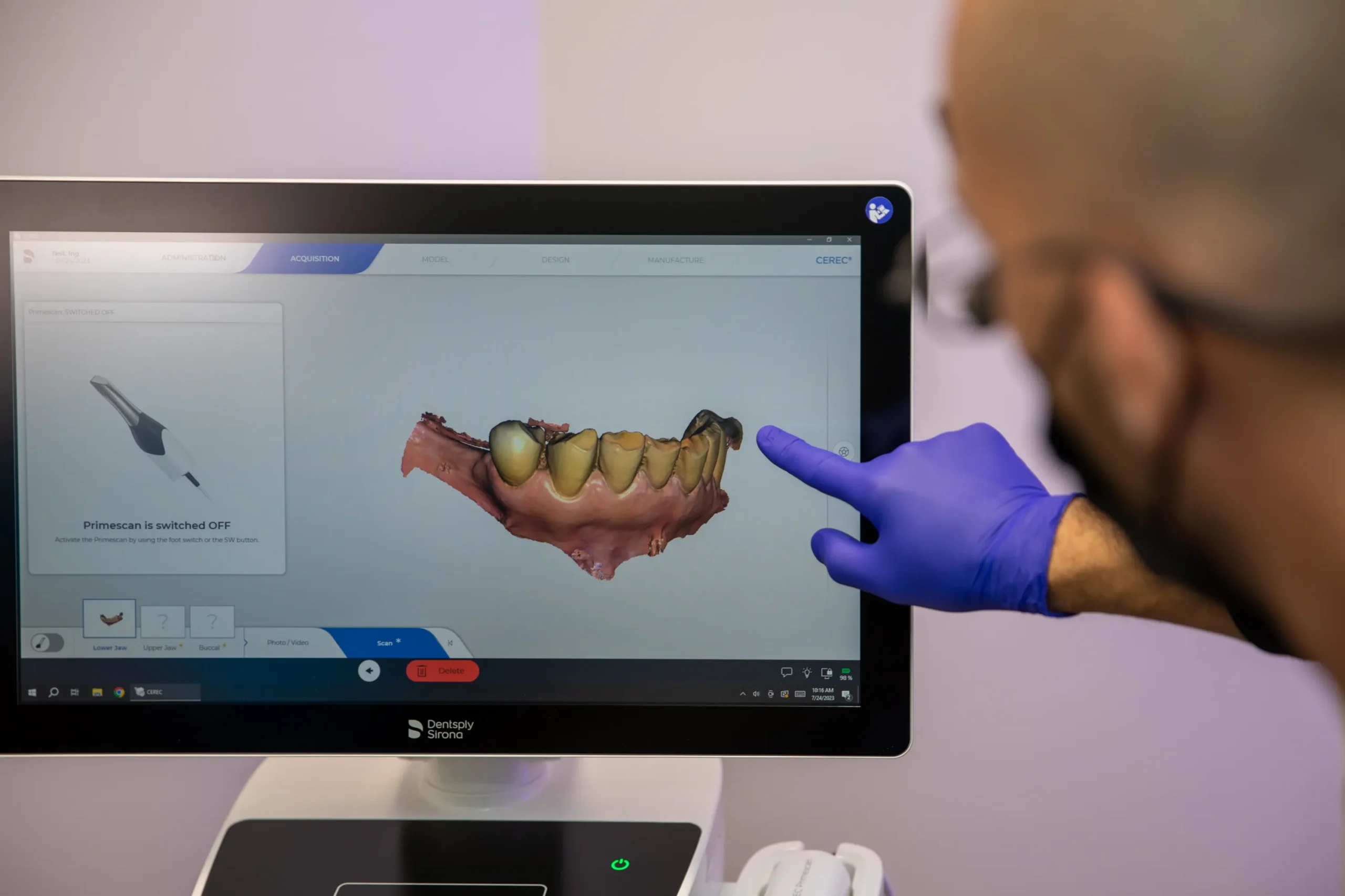 Dr. Halaby observing dental model at The Dental Implant center in Farmington, NY