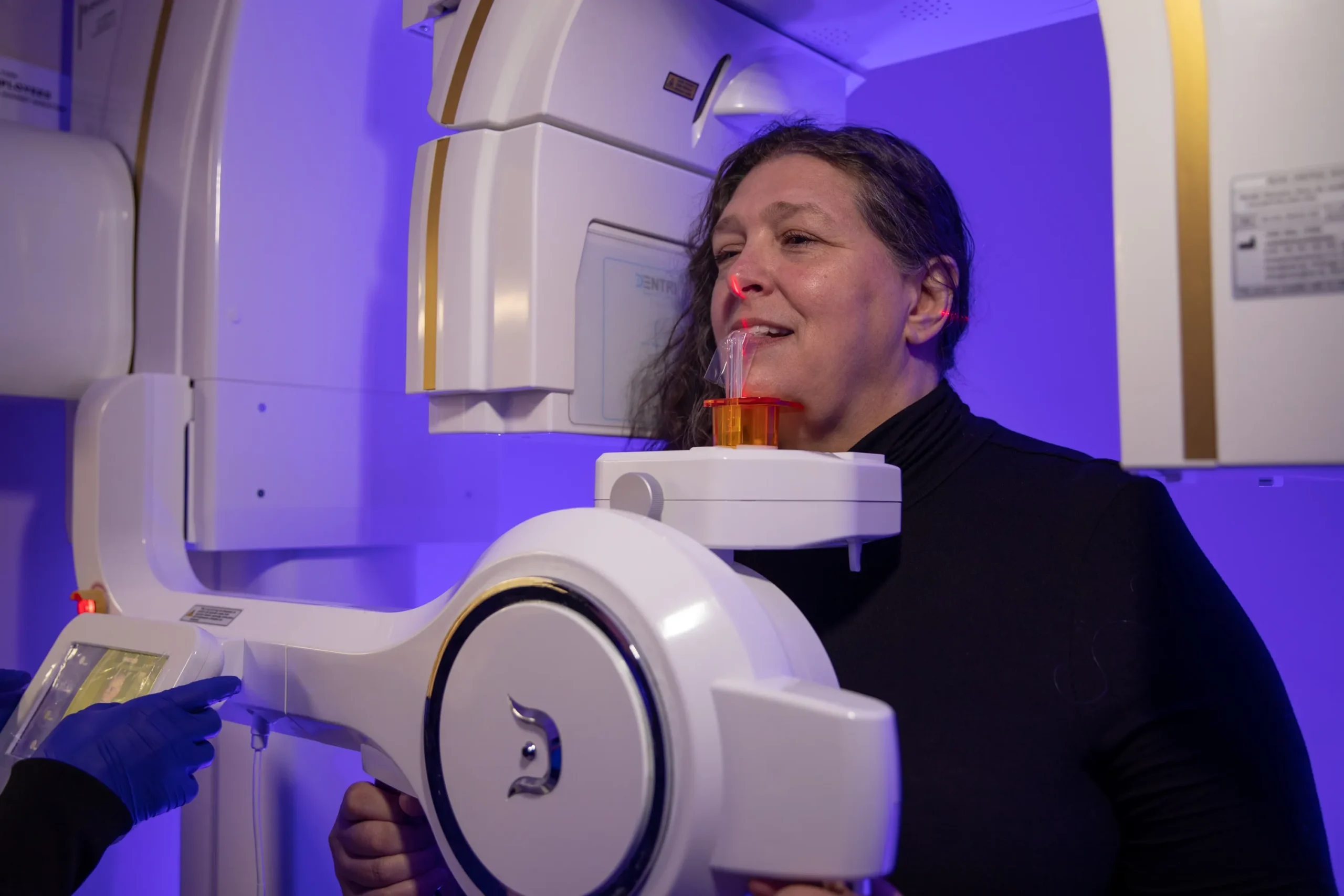 Patient during dental examination at The Dental Implant Center in Farmington, NY